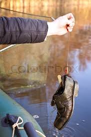 A beautiful fish caught up the river in a shallow trout stream 2 and a half kilos or five and 1/2 pounds in old money! A Fisherman Caught A Boot On A Stock Image Colourbox