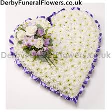 A funeral cross is a beautiful way of representing loved ones. Heart White With Blue Ribbon Funeral Flowers Derby