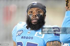 Kyran Moore of the Edmonton Elks catches a football during warm up... News  Photo