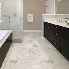 A blend of chocolate, khaki and taupe tones, this limestone tile lends richness to traditional and contemporary spaces. 5 Ways To Get The Marble Look Without The Marble Price By Brittany Devenyi Http Www Styleathome Vinyl Flooring Bathroom Bathroom Vinyl Marble Bathroom Floor