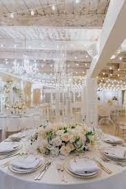 40 round wedding table decor ideas you'll love. White Ivory Round Table Wedding Centrepiece With Tall Glass Candle Holders Round Wedding Tables Wedding Table Decorations Elegant Round Table Centerpieces