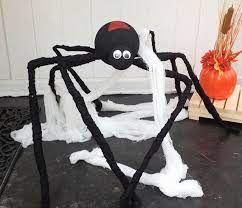 Attach skeletons outside your home to the wall to make them climbing. Diy Giant Porch Spider For Halloween 365 Days Of Crafts Halloween Spider Decorations Easy Halloween Decorations Halloween Decorations
