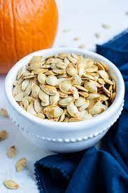 How To Make Roasted Pumpkin Seeds Super Crunchy Evolving Table Recipe Pumpkin Seed Recipes Roasted Pumpkin Seeds Easy Pumpkin Seeds