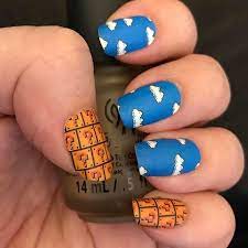 sweetmicga leveled up her nerdmanicure with a sweet design that brings all the nostalgia to the table world 1 1 ecboombox manicure nail art games nails