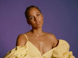 She is wearing a fair top and a dark skirt. Alicia Keys Talks New Song With Khalid And Make Up Line With E L F