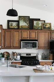 9 New Ideas For Decorating Above Your Kitchen Cabinets Above Kitchen Cabinets Kitchen Cabinets Decor Decorating Above Kitchen Cabinets