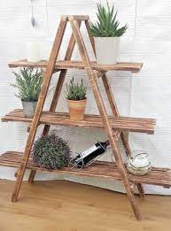 You'll need medium density fiberboard, wood glue, clamps, wood paint, sanding paper, and screws. Rustic 3 Tier Wooden Ladder Shelf Shelves Bookcase Plant Flower Shelving Ladder Shelf Decor Wooden Ladder Shelf Wooden Diy