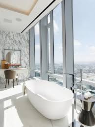The bathtub has a single pane of glass to avoid splashes as well as a shelf embedded in the wall tiles. Best 48 Modern Bathroom Marble Walls Freestanding Tubs Design Photos Dwell