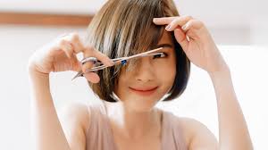 Hold your hair at the elastic to keep it from coming loose. Here S How To Diy Perfect Hair Layers At Home