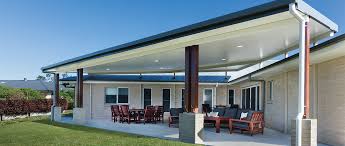 Rooftop wood patio as well as glass railing optimize the sight bordering this modern house #rooftopideas#rooftopdeck#railingideas#. Flyover Patios