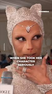 Doja Cat dressed up as a cat and responds like a cat