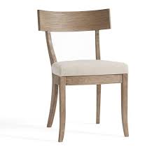 A subtle curve can make a dining room chair that much more interesting. Dana Curved Seadrift Wood Linen Dining Chair