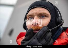 BALTIC SEA (Jan. 12, 2023) Seaman Brian Weyer points to a smoke float  during a simulated man overboard drill aboard the Arleigh Burke-class  guided-missile destroyer USS Roosevelt (DDG 80), Jan. 12, 2023.