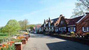 From the top, view 36 acres of gardens, dikes, & canals. Windmill Island Gardens Park Review Conde Nast Traveler