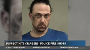 Suspect hits cruisers, police fire shots