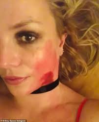 Britney Spears shares bizarre murder mystery post as she's pictured  HANDCUFFED in negligee