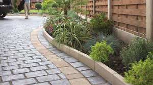 I laid the edging in a dry run next to the garden to determine stone placement for the best visual design. Buff Kerbs Edging Edging Stones Marshalls