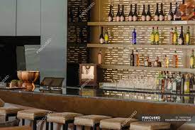 Modern nail bar highlights a spacious and inviting patio with comfortable outdoor furniture. Luxury Bar And Barstools In Modern House Comfortable Style Stock Photo 199391660