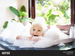 Find out what bath products you need and tips to bathe your baby safely. Child Bubble Bath Kid Image Photo Free Trial Bigstock