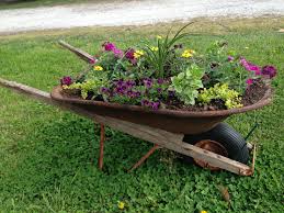 Pin By Erick Moore On Lawn Wheelbarrow Garden Wheelbarrow Planter Wheelbarrow