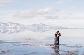 Engagement Photos At The Salt Flats In Utah Utah Wedding Photographer Adventurous Utah Photography Winter Engagement Pictures Utah Wedding Photographers