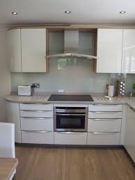 Explore our range of glossy surfaces on our online store. White Gloss Kitchen With Grey Tiles Novocom Top