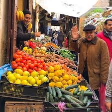 Men At A Fruit Market Stand In Fez Morocco Fruit And Veg Fruit Best Fruit Salad