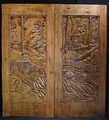 Antique reproductions, floral accents, detailed wildlife, anything you could imagine can be carved from wood for your house doors. Hold The Door Some Beautiful Carved Wood Front Doors Carved Doors Wood Front Doors Wooden Doors Interior
