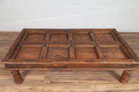 Homcom farmhouse coffee table with sliding mesh barn door, storage cabinet, and adjustable shelves, dark brown 4.3 out of 5 stars 28 $116.99 $ 116. Antique Sheesham Wood Indian Palace Door Made Into Coffee Table With Iron Studs At 1stdibs