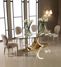 Glass top dining room sets are contemporary, easy to clean and pleasing to the eye. 15 Astonishing Oval Dining Tables For Your Modern Dining Room Modern Dining Tables Glass Dining Set Elegant Dining Room Glass Dining Table