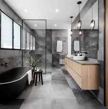 Ванная комната в современном стиле с отдельно. A Cloudy Grey Tile Sets The Palette For This Bathroom