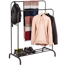 African american showroom owner working with clothes on hanging rack on blurred foreground. Multifunctional Black Metal Coat Rack With Double Hanger And Low Shelf Cablematic