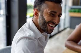 Portrait of Smiling Young Male Professional Sitting in Cafe Stock Image
