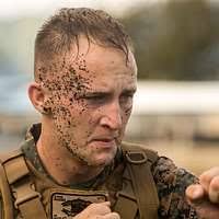 U.S. Marine Corps Sgt. Sean Charbonneau, top, 22nd