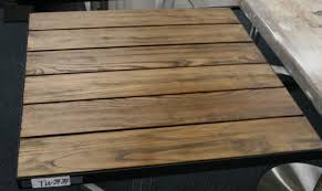 Custom polished cold rolled steel table base with clear lacquer finish. Teak Plank Wood Tabletop