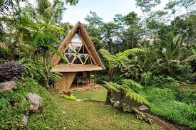 An Eco Bamboo House In Bali Indonesia Nestled In The Mountains Of A Volcano Featuring A Water Wheel To Provides Eco House Design Bali