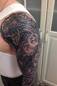 40 Fantasy Dragon Tattoos Designs Images And Ideas Tattoos For Guys Dragon Tattoo Warrior Tattoos