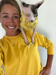 A girl and her cat in her family's kitchen in San Antonio, 1939. The  poverty is extreme but both the girl (and the cat) look well nourished.