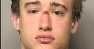 Man arrested after found hiding under hotel bed