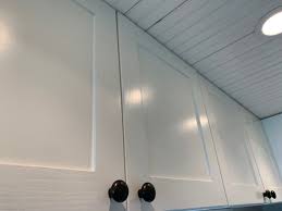 Not only is there a lot to paint, but there's also the matter of picking out the best hardware. Painting Our Ikea Oak Kitchen Cabinet Doors White