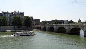 In This Photo You Can See The Oldest Bridge In Paris The Pont Neuf With A Batobus Boat Coming U Paris Tourist Attractions Holiday Travel Tourist Attraction