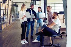 Smart casual dressing shouldn't veer towards slovenliness. Working As A Team Full Length Of Young Modern People In Smart Casual Wear Planning Business Strategy While Young Woman Stock Image Image Of Team Blueprint 126361769