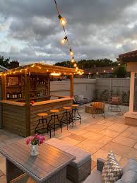For the shade structure, the designers reached high to enable a connection to the existing structure, create visual interest, and make the. Garden Bar Ireland
