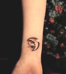 50 Examples Of Moon Tattoos Cuded Half Moon Tattoo Wolf And Moon Tattoo Moon Star Tattoo