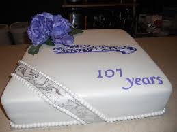 Frosted with passion fruit bc & covered with white chocolate fondant.yummy. Church Anniversary Cakes