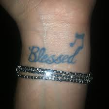 Needless to say that that music tattoos symbolize your love for music. Black Blessed With Music Note Tattoo On Inner Wrist For Women