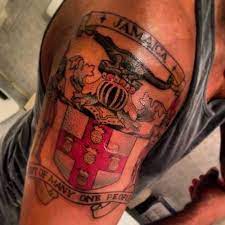 Excellent black and gray shading is applied to create the gnarled and twisting trunk of the tree which contains different taino characters within it: Pin By Raphael Smith On All Things Jamaican Jamaican Tattoos Arm Tats Tattoos