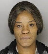 Erie woman admits role in death