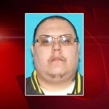 Naked carjacking suspect killed by officers tied to shooting