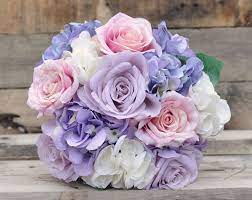 Blush wedding bouquet with white peonies and light pink and peach roses. Silk Wedding Flower Bouquet Made With Lavender Roses Lavender Hydrangea Soft Flower Bouquet Wedding Wedding Flower Bouquets Vintage Wedding Bouquet Champagne